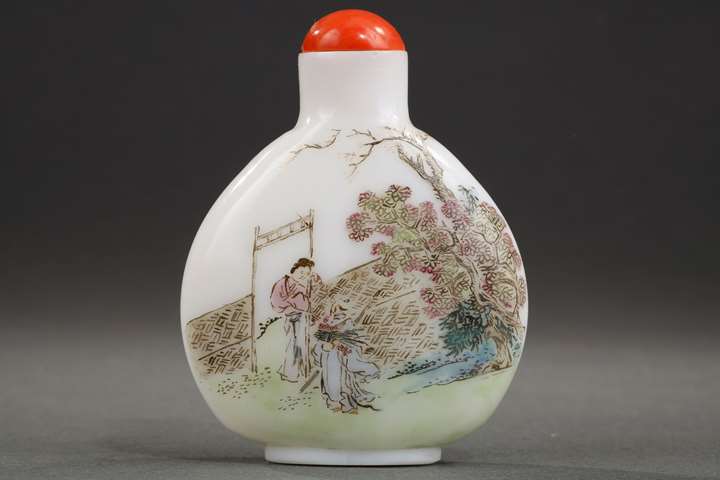 Enamelled glass snuff bottle on white background of characters in landscapes